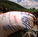 man carrying sack of grain